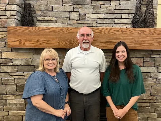 pharmacist greeting a patient inside Holdrege Pharmacy
